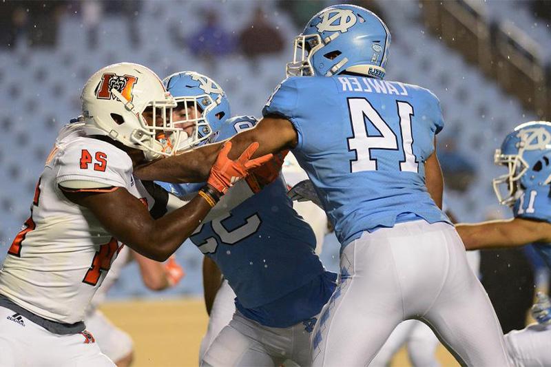 Jake Lawler playing defense during a college football game between UNC-Chapel Hill and Campbell University.